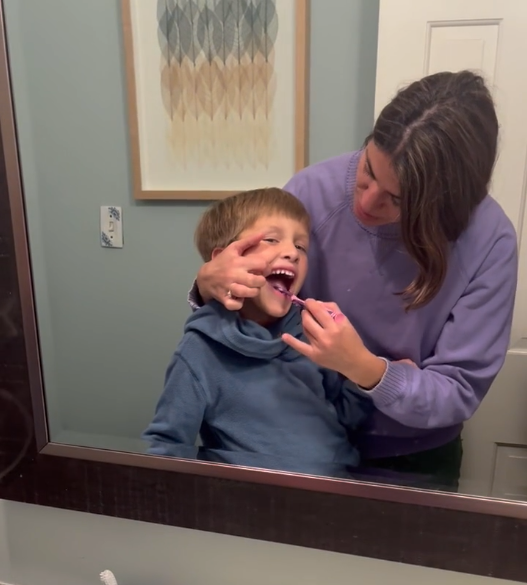 Brush kids teeth at home